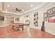 Open basement layout with game and exercise areas, all with hardwood floors at 5118 Greythorne Ln, Marietta, GA 30068