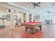 Spacious recreation room with a pool table, ceiling fans, and hardwood floors at 5118 Greythorne Ln, Marietta, GA 30068
