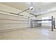 A clean three-car garage with epoxy floors and special car lift for extra vehicles at 5118 Greythorne Ln, Marietta, GA 30068