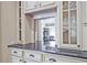 Kitchen with granite countertops, custom cabinetry and an open view to the dining area at 5118 Greythorne Ln, Marietta, GA 30068