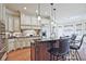 Gourmet kitchen with granite counters, stainless steel appliances, and breakfast bar seating at 5118 Greythorne Ln, Marietta, GA 30068