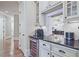 Elegant kitchen features granite countertops, stainless steel appliances, and wine cooler at 5118 Greythorne Ln, Marietta, GA 30068