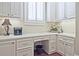 Bright office with white cabinets, drawers, desk space, and natural light with a decorative lamp at 5118 Greythorne Ln, Marietta, GA 30068