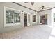 Covered brick patio featuring multiple entrances and views of the backyard at 5118 Greythorne Ln, Marietta, GA 30068