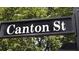 Street sign for Canton Street against a backdrop of green trees and foliage at 5118 Greythorne Ln, Marietta, GA 30068