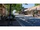 Charming street view lined with shops and restaurants offering outdoor seating on a sunny day at 5118 Greythorne Ln, Marietta, GA 30068