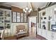 Spacious study with custom shelving, a comfortable sitting area, and elegant decor at 5118 Greythorne Ln, Marietta, GA 30068