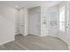 A newly renovated entryway with gray wood floors, white walls, and a staircase to the second floor at 6093 Camden Forrest Ct, Riverdale, GA 30296