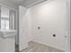 Laundry room with white walls and vinyl flooring, ready for washer and dryer at 6093 Camden Forrest Ct, Riverdale, GA 30296