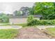 Side view of home's exterior featuring front yard and foliage at 6255 Saddlewood Dr, Lithonia, GA 30058
