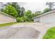 View of home's exterior showcasing two-car garage, attached house and driveway at 6255 Saddlewood Dr, Lithonia, GA 30058