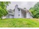 Two-story home with a chimney and multiple large windows at 6255 Saddlewood Dr, Lithonia, GA 30058