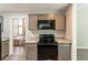 Kitchen area featuring granite counters and black appliances at 6255 Saddlewood Dr, Lithonia, GA 30058
