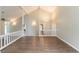 Spacious living room with vaulted ceilings and hardwood floors, creating an airy atmosphere at 6255 Saddlewood Dr, Lithonia, GA 30058