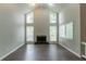 Spacious living room with vaulted ceilings, fireplace, and windows at 6255 Saddlewood Dr, Lithonia, GA 30058