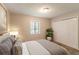 Comfortable main bedroom featuring neutral décor, soft carpet, and natural light at 6255 Saddlewood Dr, Lithonia, GA 30058