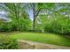 Back yard with manicured lawn and well-kept perimeter landscaping at 185 Elizabeth St, Atlanta, GA 30307