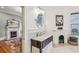 Bathroom with dark vanity, marble counters, fireplace, and a view into the bedroom at 185 Elizabeth St, Atlanta, GA 30307