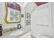 Charming powder room featuring a granite vanity and patterned wallpaper at 185 Elizabeth St, Atlanta, GA 30307
