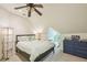 Tranquil bedroom space featuring a ceiling fan, carpet and neutral walls at 185 Elizabeth St, Atlanta, GA 30307