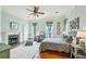 Charming bedroom with a fireplace, ceiling fan, and hardwood floors, offering a comfortable retreat at 185 Elizabeth St, Atlanta, GA 30307