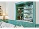 Close-up of a built-in bar with mirrored backsplash and stylish decor at 185 Elizabeth St, Atlanta, GA 30307