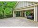 Spacious carport with rear gate and a peek at the backyard treehouse at 185 Elizabeth St, Atlanta, GA 30307