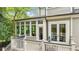 Charming outdoor deck with a dining table and chairs, perfect for enjoying the lush greenery at 185 Elizabeth St, Atlanta, GA 30307