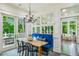Dining area with a rustic table, banquette seating, and views of the outdoors at 185 Elizabeth St, Atlanta, GA 30307