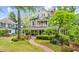 Beautiful home with a lush front yard, mature trees, and inviting front porch, showcasing curb appeal at 185 Elizabeth St, Atlanta, GA 30307