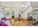 Bright foyer featuring a grand staircase, chandelier, and stained-glass windows at 185 Elizabeth St, Atlanta, GA 30307