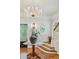 Elegant foyer featuring staircase, chandelier, stained glass, and hardwood floors at 185 Elizabeth St, Atlanta, GA 30307