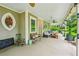 Expansive front porch featuring seating, decor, and stylish fixtures at 185 Elizabeth St, Atlanta, GA 30307