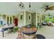 Large, covered porch with multiple seating areas and unique decor at 185 Elizabeth St, Atlanta, GA 30307