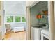 Bright laundry area with natural light, washer, dryer, and ample storage creating a functional space at 185 Elizabeth St, Atlanta, GA 30307