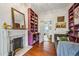 Cozy living room with hardwood floors, purple built-in bookshelves, and fireplace at 185 Elizabeth St, Atlanta, GA 30307
