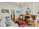 Bright living room with a fireplace, hardwood floors, and comfortable seating arrangements at 185 Elizabeth St, Atlanta, GA 30307