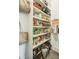 Pantry with shelves stocked with food and household items at 185 Elizabeth St, Atlanta, GA 30307