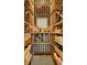 Custom wine cellar with ample storage for wine bottles and wooden boxes at 185 Elizabeth St, Atlanta, GA 30307