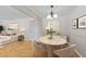 An open dining room area with modern decor, hardwood flooring, and lots of light at 3486 Essex Ave # 88, Atlanta, GA 30339