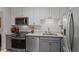 A modern kitchen with stainless steel appliances, sleek countertops, and stylish cabinetry at 3486 Essex Ave # 88, Atlanta, GA 30339