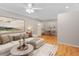 A bright living room that opens to the dining area with hardwood floors and fresh paint at 3486 Essex Ave # 88, Atlanta, GA 30339