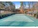 A tennis court features basketball hoops and a clubhouse in a beautiful and serene setting at 3486 Essex Ave # 88, Atlanta, GA 30339
