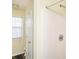 Bathroom with a shower, toilet, and window providing lots of natural light at 4157 Lake Mist Nw Dr, Kennesaw, GA 30144