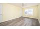 This bedroom offers neutral colors, laminate wood flooring, and is equipped with a ceiling fan at 4157 Lake Mist Nw Dr, Kennesaw, GA 30144