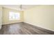 This cozy bedroom has grey laminate wood flooring and ample natural light with a ceiling fan at 4157 Lake Mist Nw Dr, Kennesaw, GA 30144