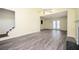 Bright living room with new gray flooring, high ceilings, a ceiling fan, and a cozy fireplace at 4157 Lake Mist Nw Dr, Kennesaw, GA 30144