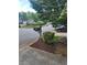 View of the mailbox and road showing the beautiful landscaping that adds to the neighborhood's charm at 4157 Lake Mist Nw Dr, Kennesaw, GA 30144