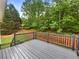 Beautiful back deck overlooking wooded area offers a great space for outdoor relaxation at 541 Mckenzie Ave, Stockbridge, GA 30281