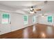 Finished basement area features hardwood floors, windows, and an exterior door at 541 Mckenzie Ave, Stockbridge, GA 30281